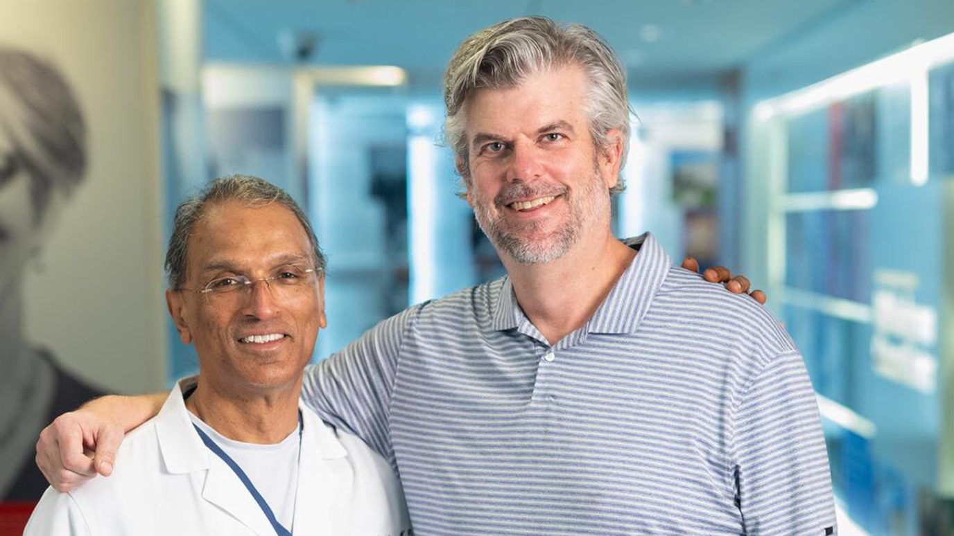 Astrocytoma survivor Andy Bell (right) with Sujit Prabhu, M.D.