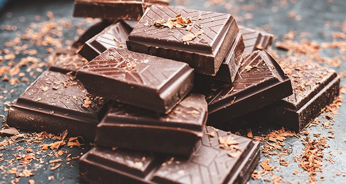 Close-up of chocolate bar broken into pieces