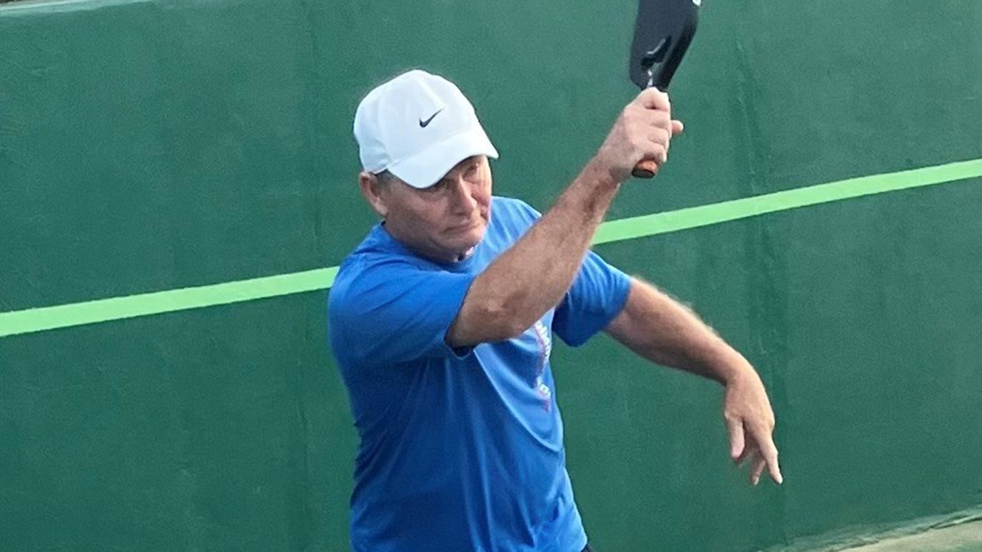 Melanoma survivor Rod Daake plays pickleball in June 2025