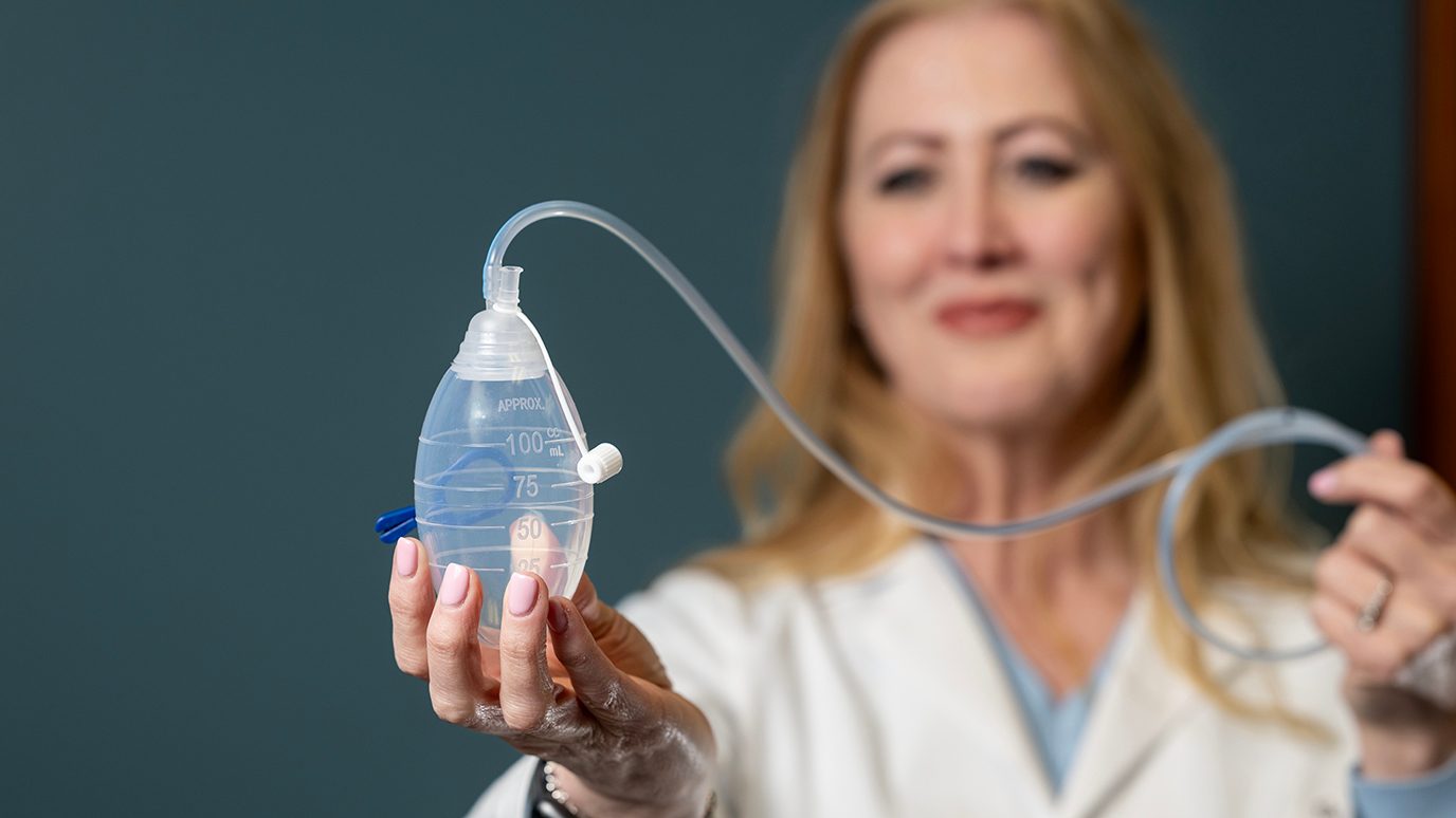 Advanced practice registered nurse Carla Patel displays a Jackson-Pratt drain