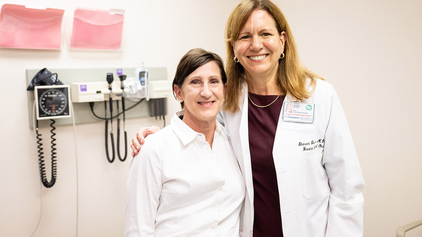 Triple-negative breast cancer survivor Melissa Fouts poses with Sharon Giordano, M.D.