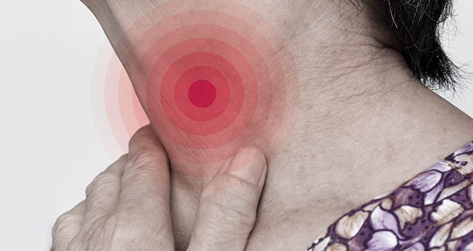 Close-up of woman touching her own neck