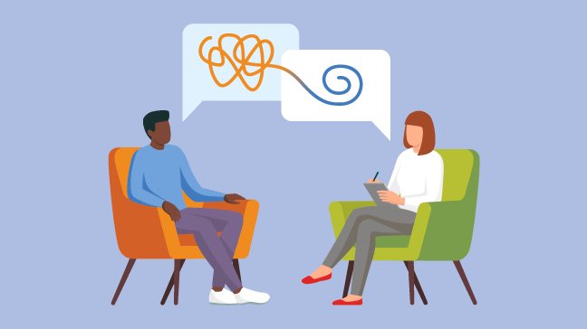 Man in an orange chair speaks with female therapist in a green chair