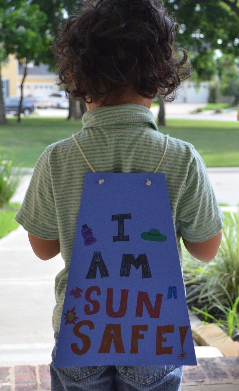 child with homemade cape