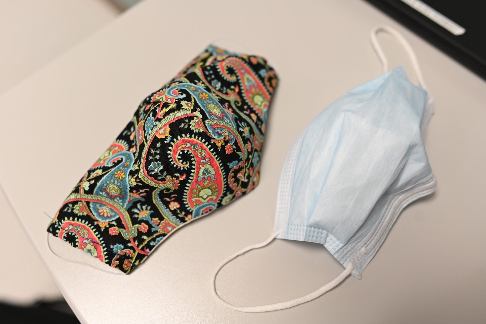 Two types of masks to help protect against coronavirus (COVID-19) infection -- a medical fabric mask (left) and face mask (right).