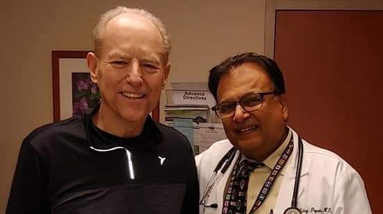 Myelofibrosis survivor Bill Crutcher with stem cell transplant specialist Uday Popat, M.D.