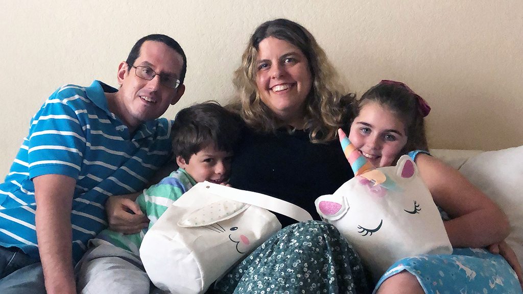 Skull base tumor survivor Matthew Saunders with his family