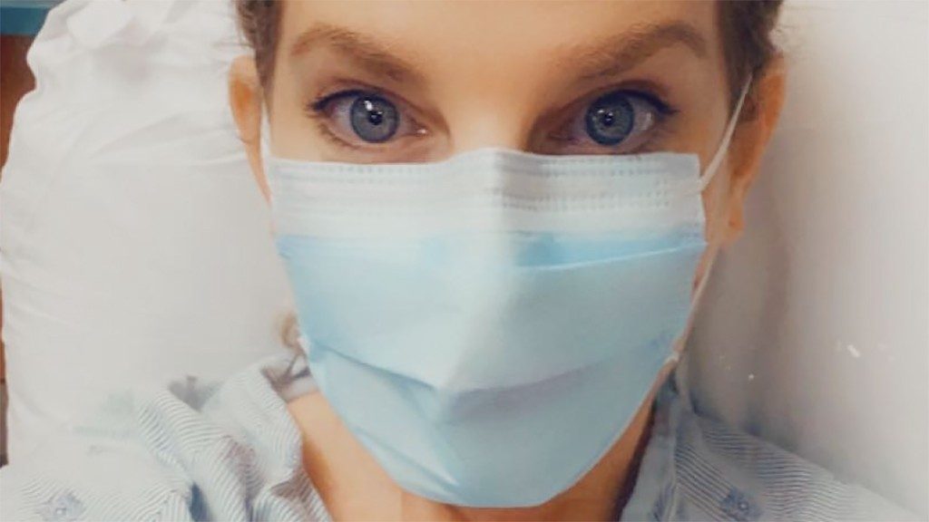 Five-time cancer survivor Lainie Jones wearing a mask