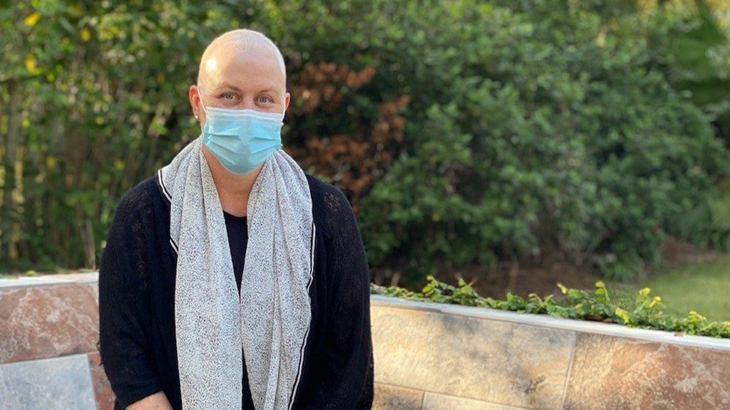 Uterine cancer survivor Kirsten Arendes wearing a mask