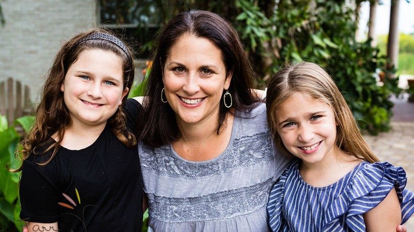 Colorectal cancer survivor Courtney Nash with her daughters, Meredith (left) and Caroline