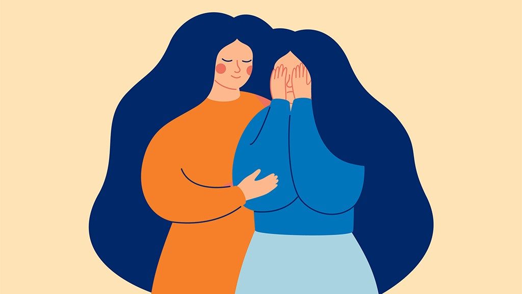 Calm woman comforting a visibly upset woman