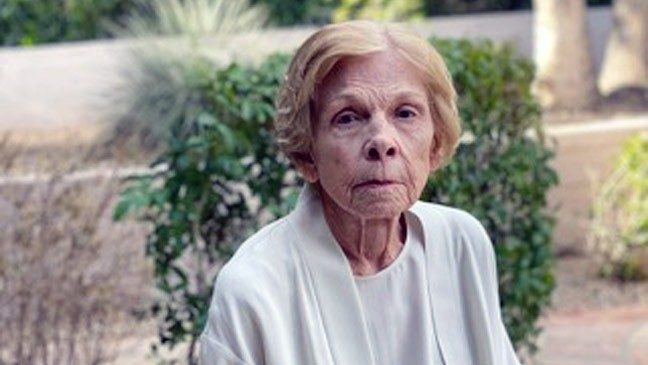 Photo of lung cancer survivor Fran Sargent sitting in her garden