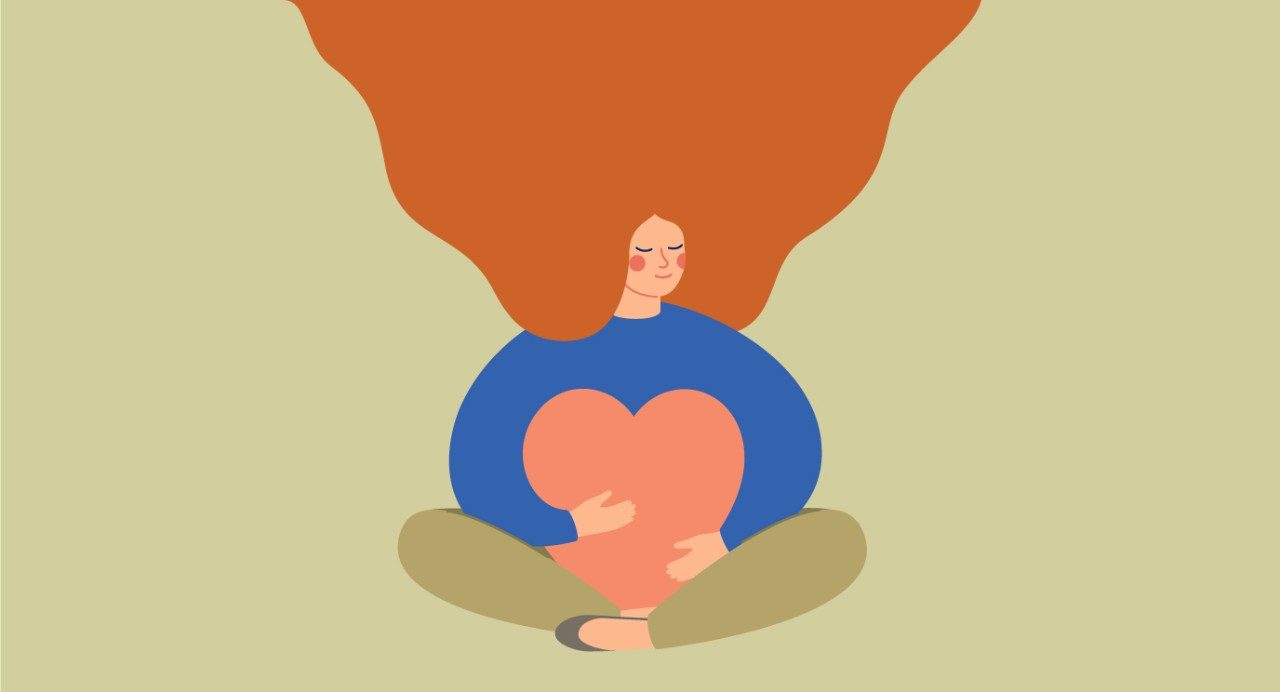 Illustration of a woman with orange hair and blue shirt sitting on the ground while hugging a pink heart.