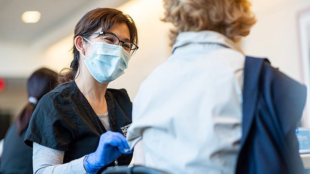 A patient gets vaccinated at MD Anderson