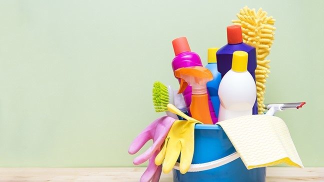 Cleaning supplies in a blue bucket