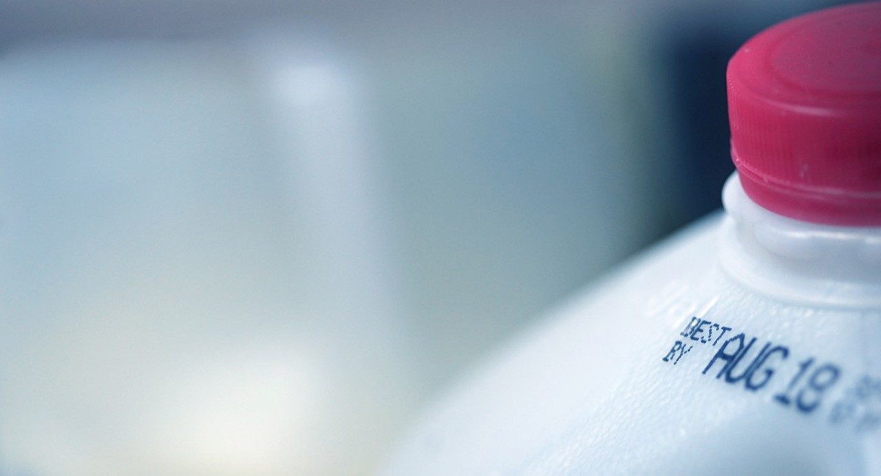 Close-up of "best by" date on a gallon of milk