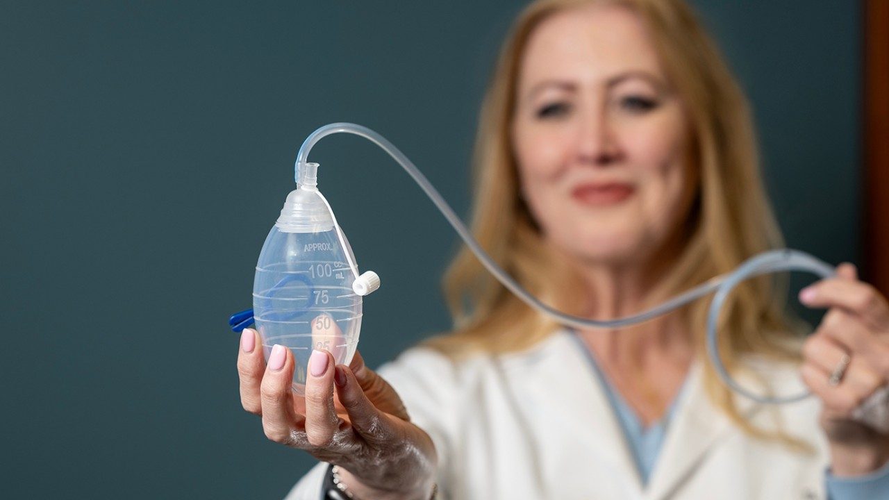 Advanced practice registered nurse Carla Patel displays a Jackson-Pratt drain