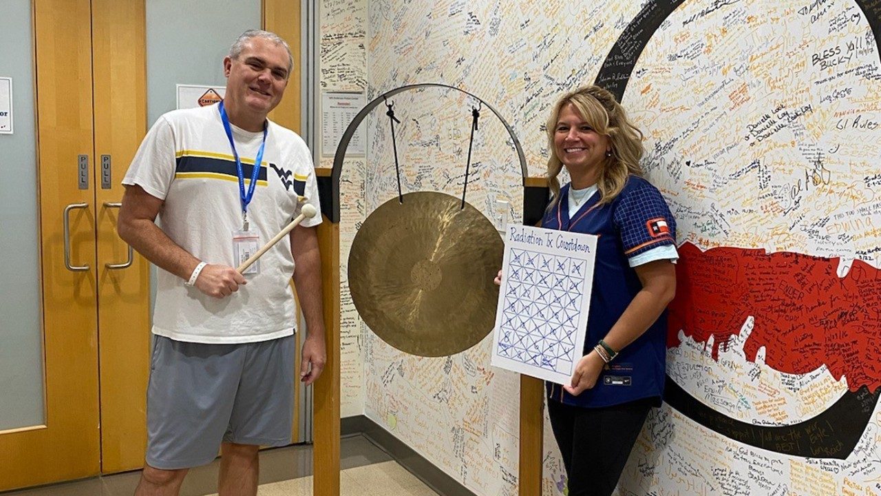 Jody Fuller and his wife, Sarah, celebrate his last proton therapy treatment in September 2024