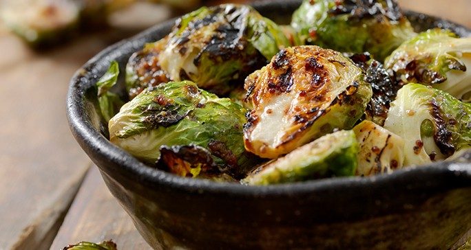 Close-up of roasted Brussel sprouts in a bowl