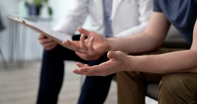 A man talks to his doctor