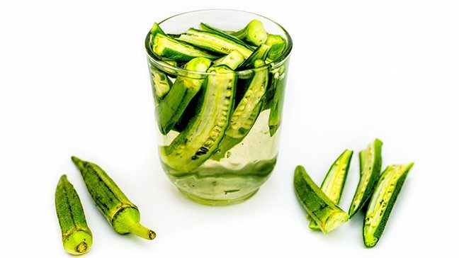 Slices of okra in a clear glass of water