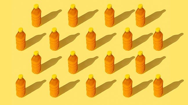 an array of juice bottles against an orange background, detox myths