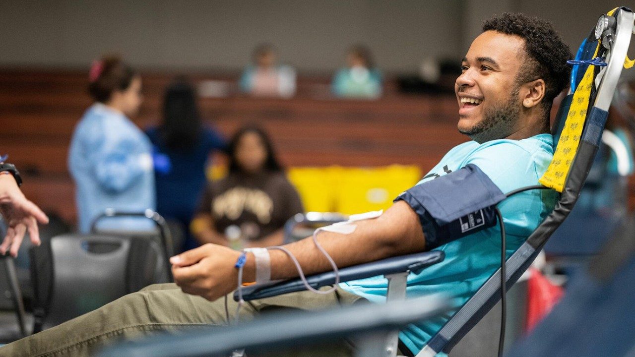 Wunsche High School senior Matthew Flowers donates blood at a UT MD Anderson blood drive in August 2023