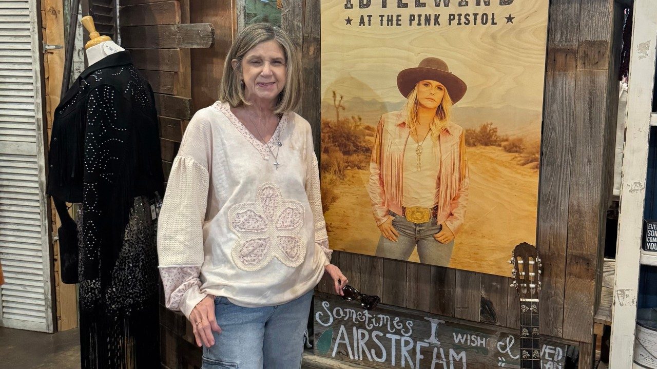 A woman stands in a retail store