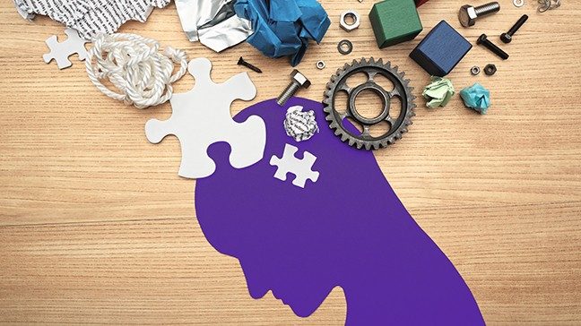 Silhouette of downcast man with random objects floating above head 