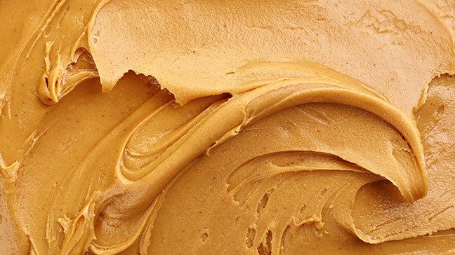 Close-up view of smear of smooth-style peanut butter