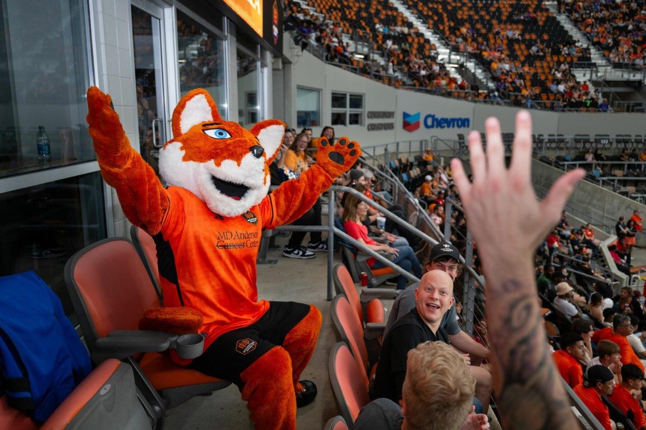Houston Dynamo FC mascot, Diesel celebrates in the stands at Shell Energy Stadium at Cancer Survivor's Night