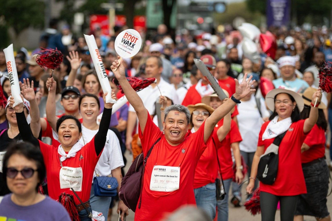 People holding boot walk signs