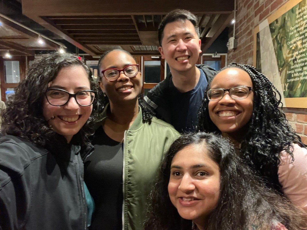 Physicians posing for a pic at a restaurant