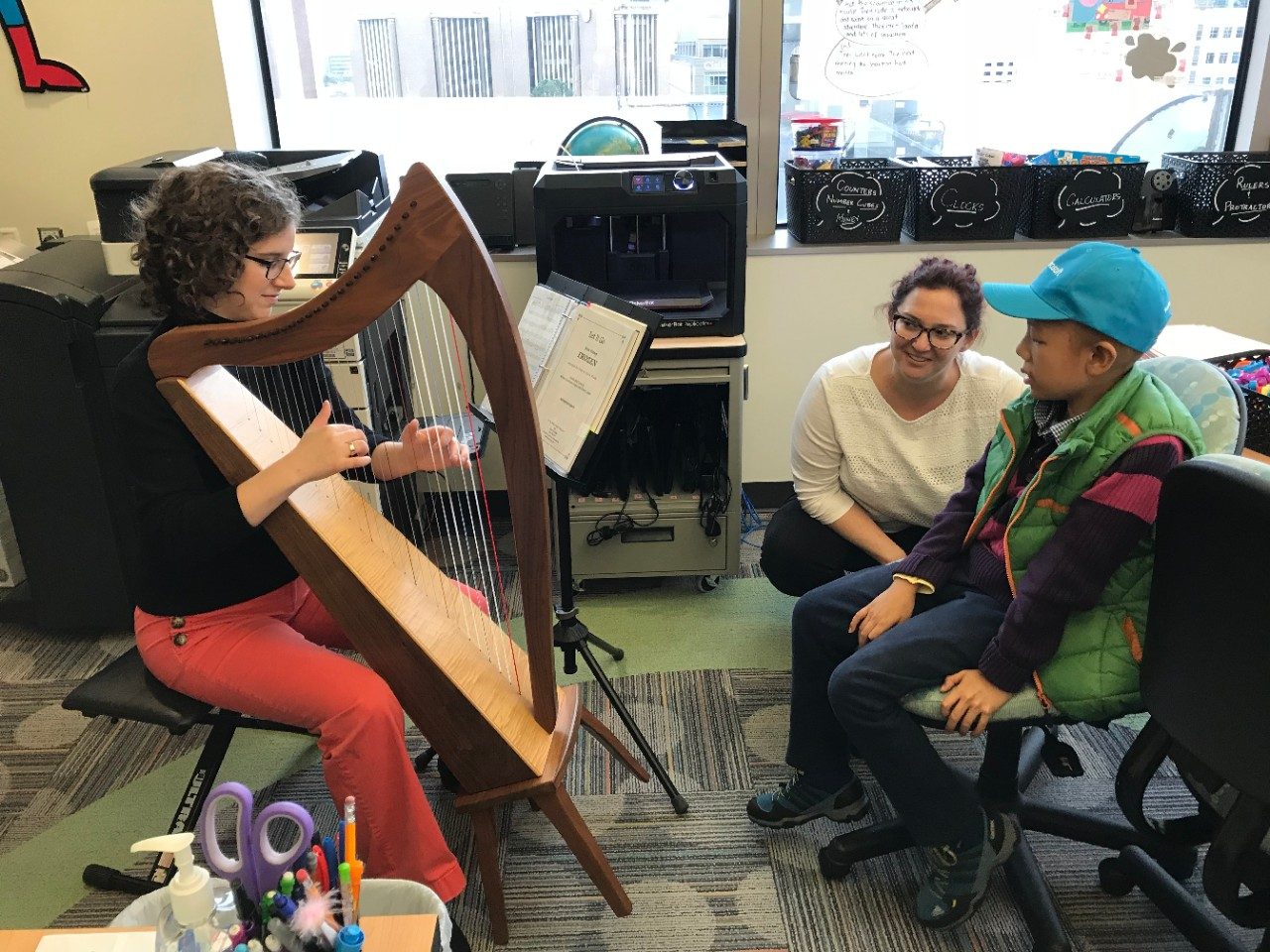Harpist plays for pediatric patient