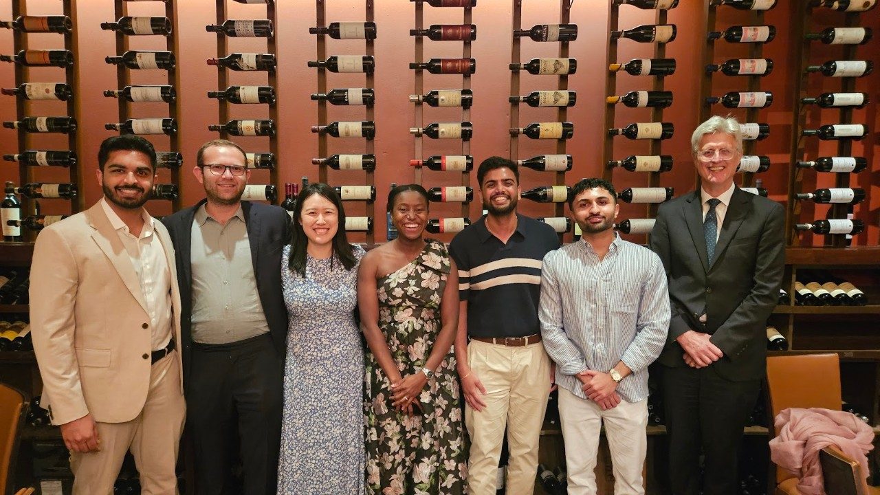 graduating residents at graduation dinner with program leadership