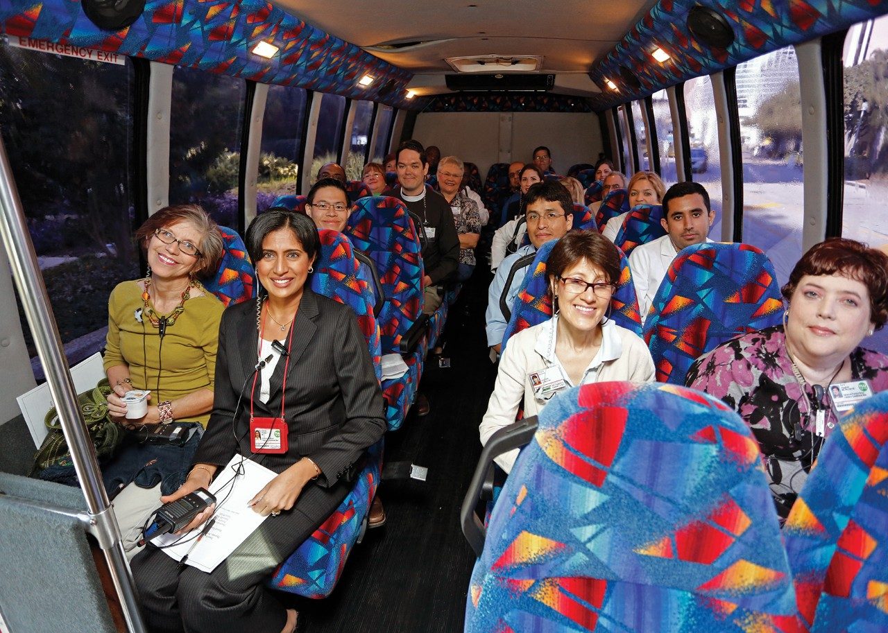 Clinicians on the Home Visits bus. (Photos excerpted from Messenger, MD Anderson's magazine for employees, volunteers, retirees and their families.)