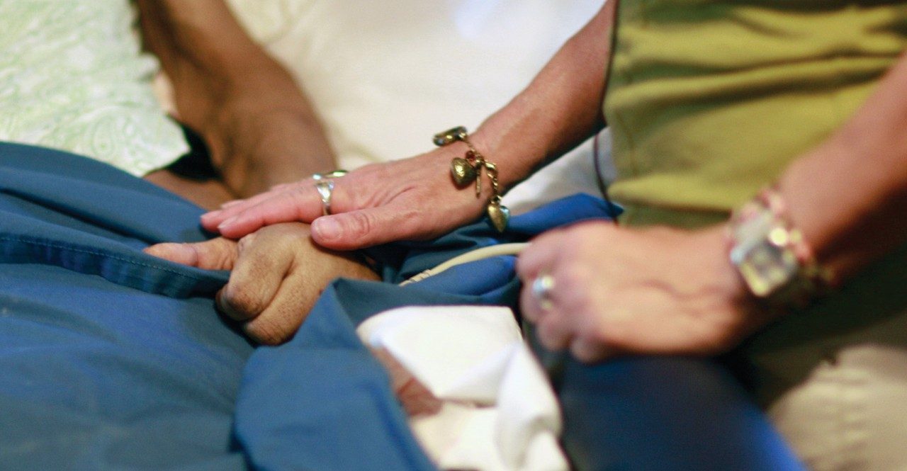 Comforting a patient during a home visit