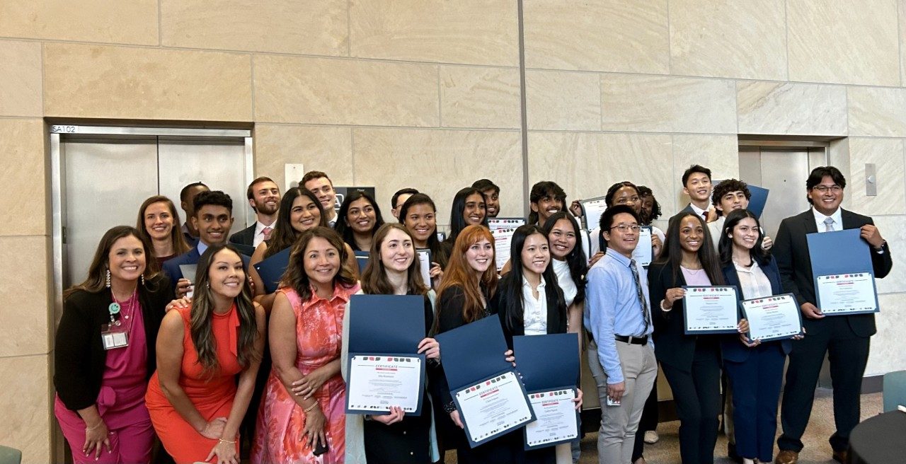 Students gathered together for a photo with education team.