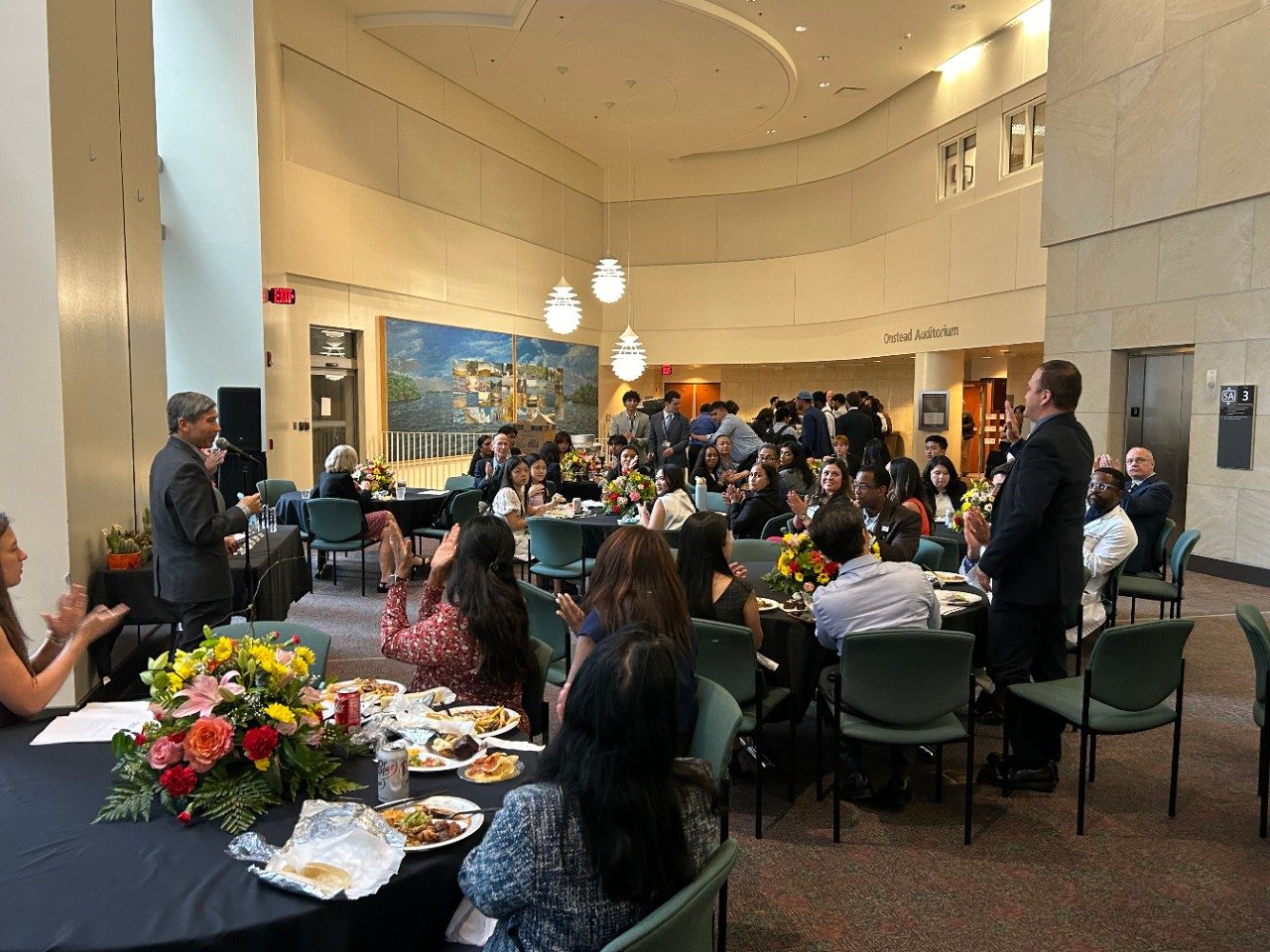 Students, mentors and guests attend the DACCPM program dinner.
