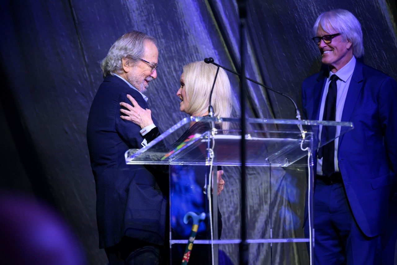 Dr. Jim Allison and melanoma survivor, Colleen Wittoesch, meet onstage for the first time.