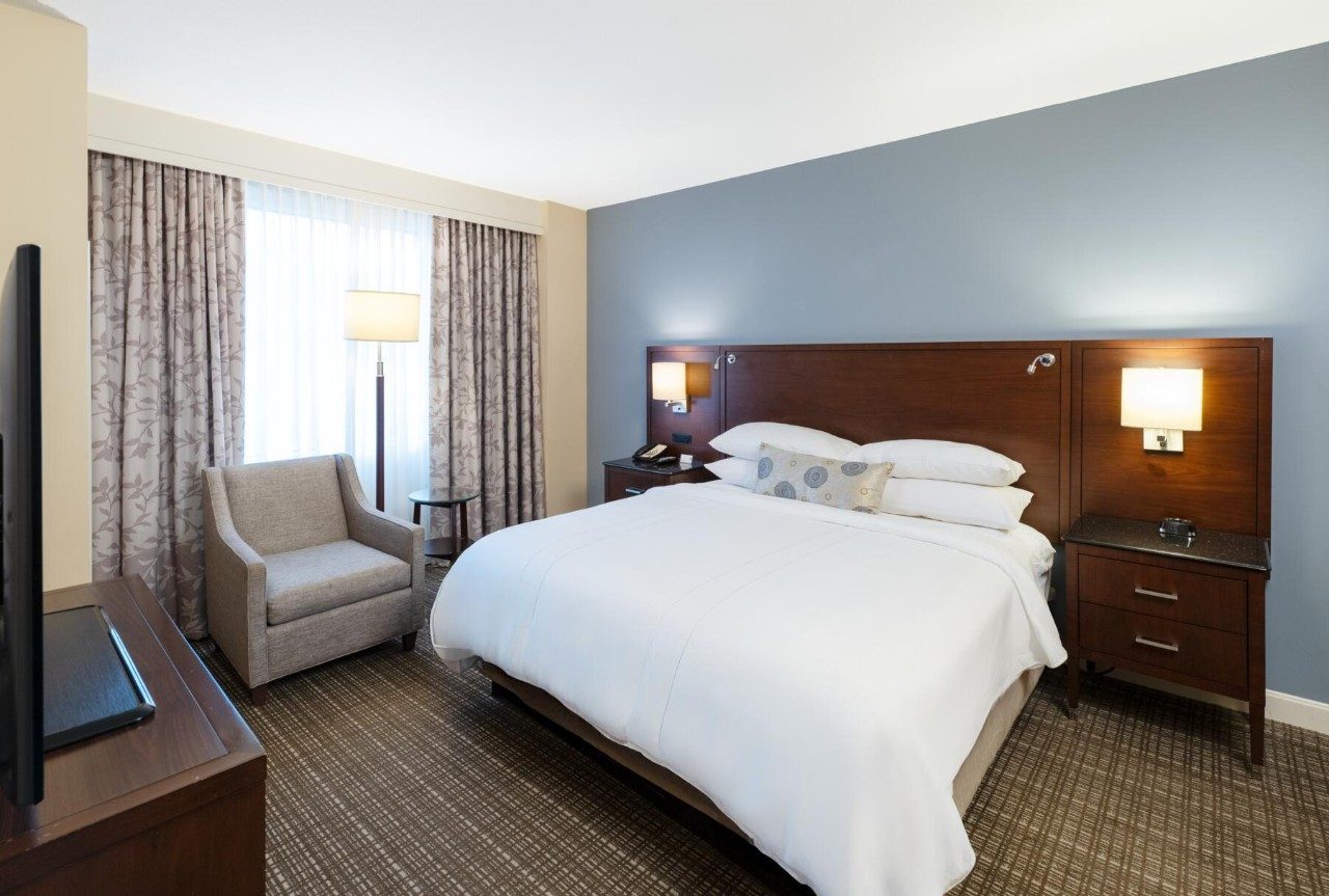 Bedroom in a suite with king bed and kitchenette