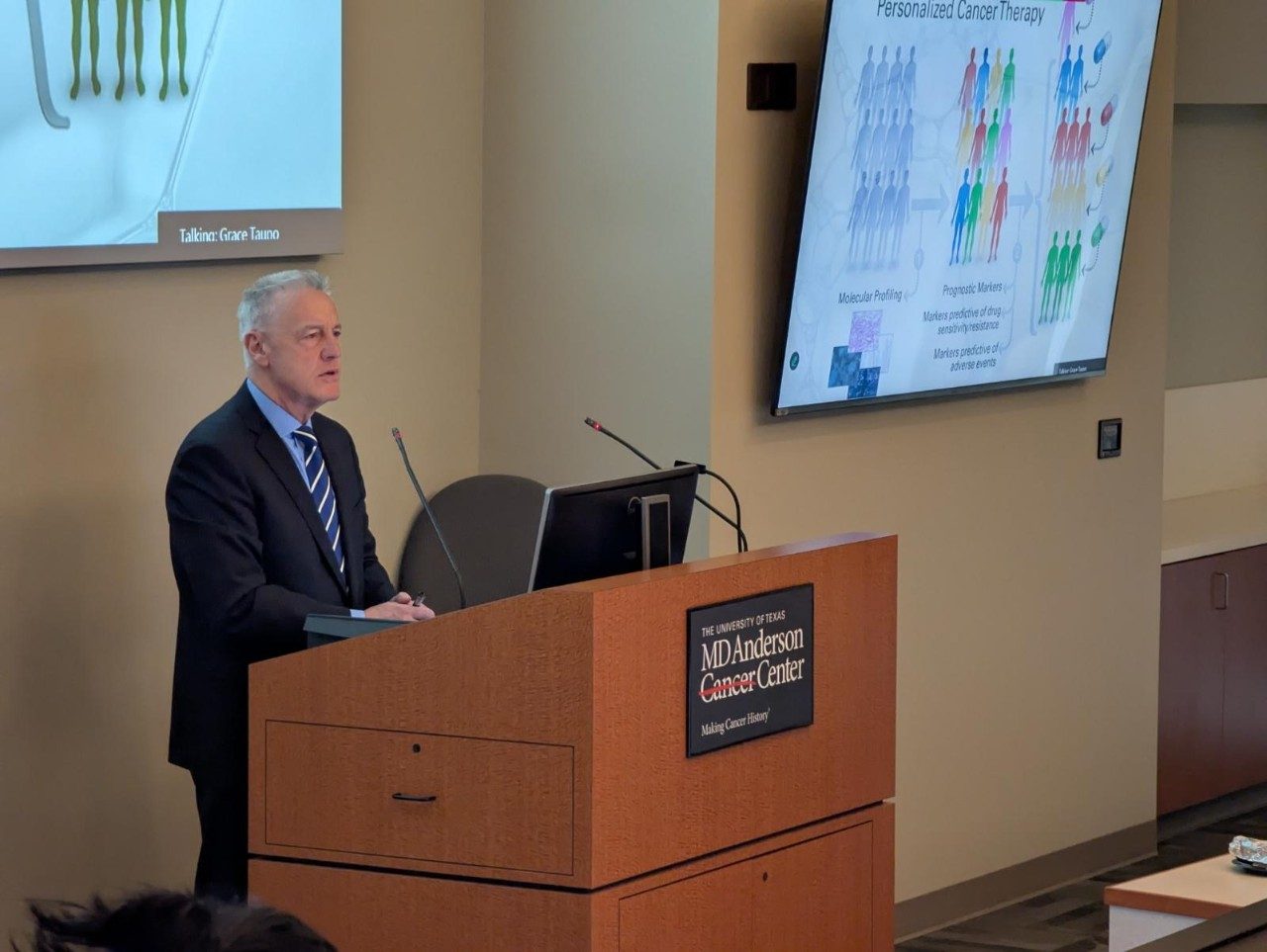 Dr. Dario Altieri speaking at podium
