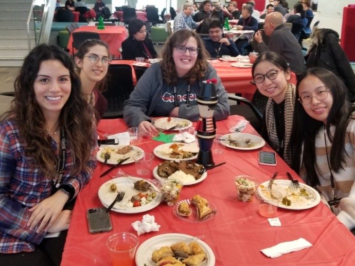 Five people sit at a table