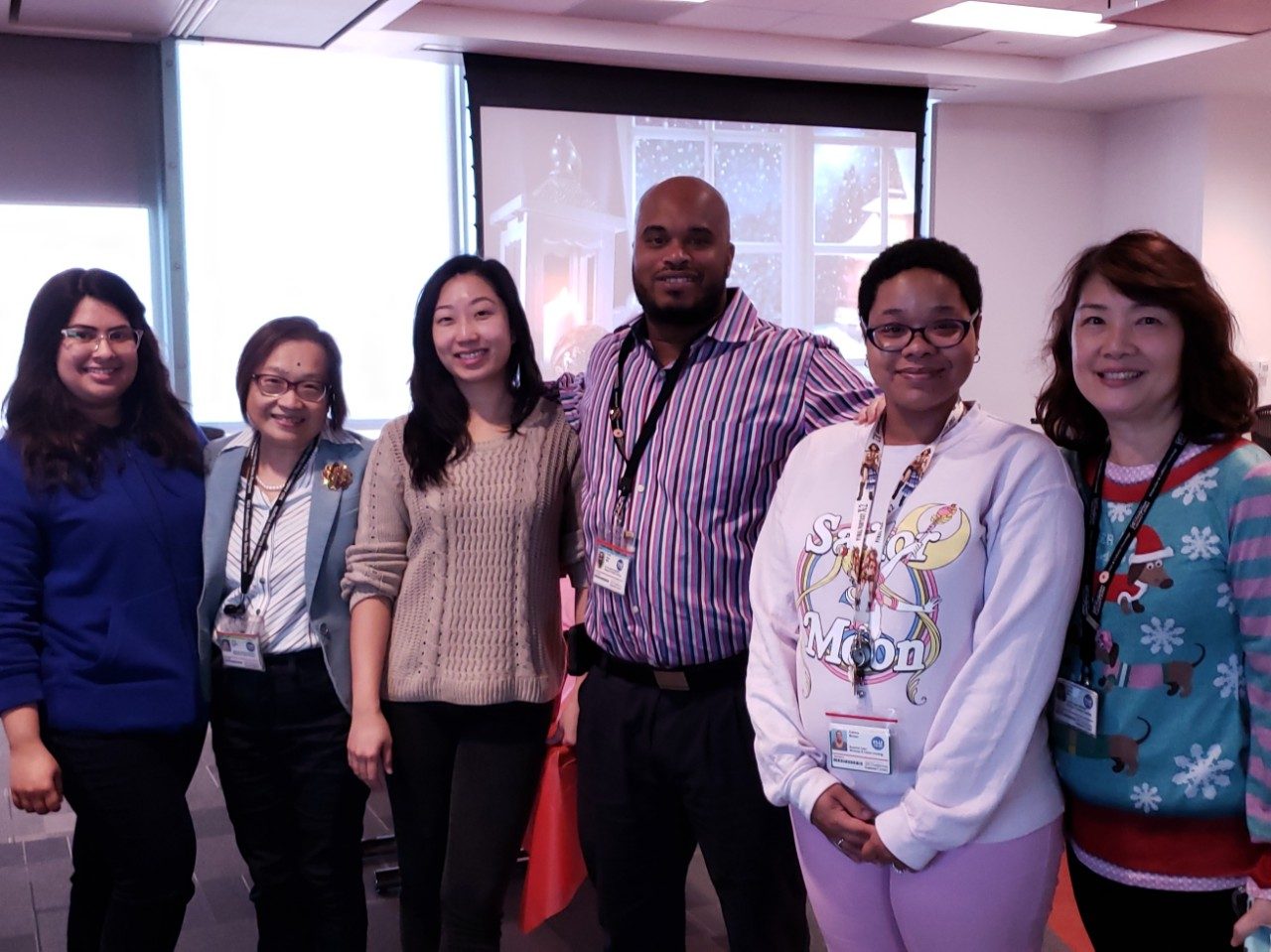 Six people standing in a line to pose