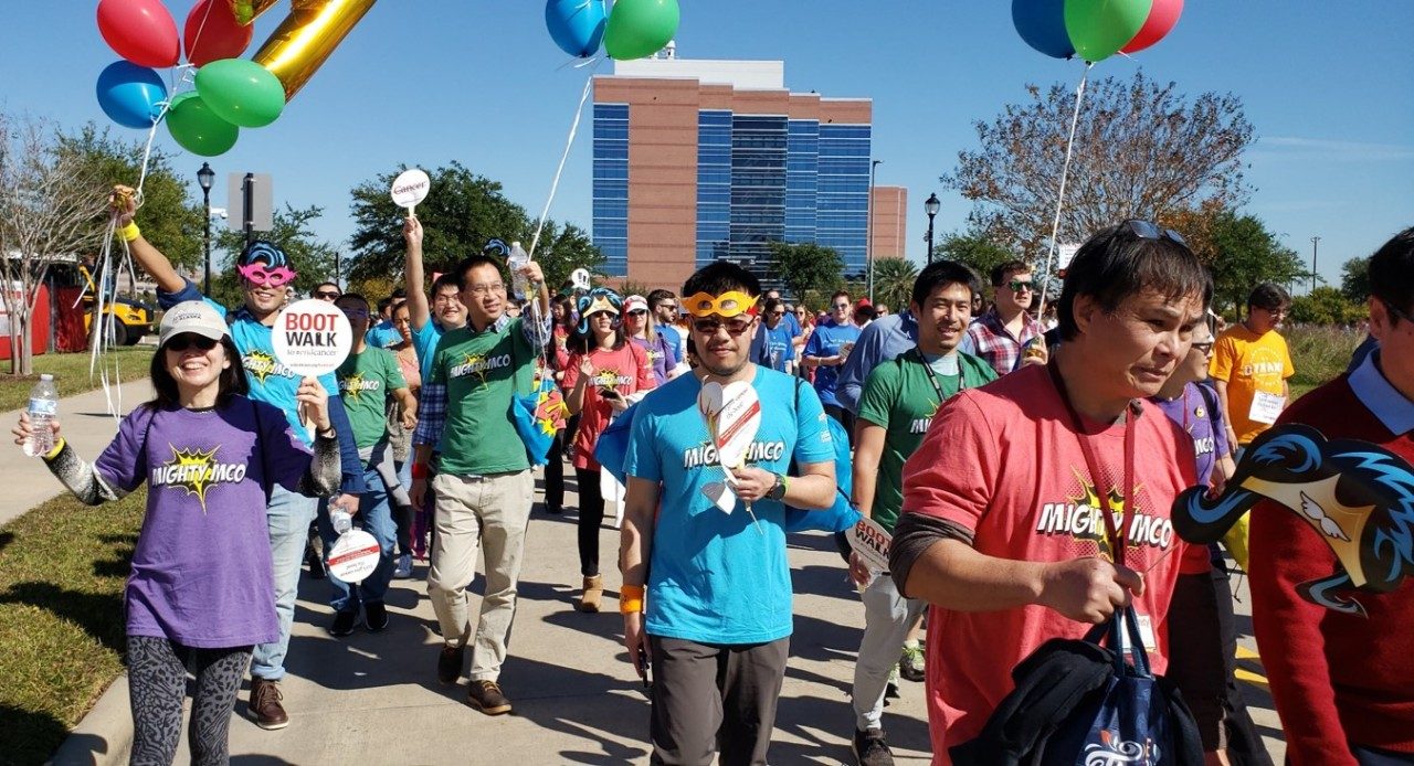 People walk with balloons