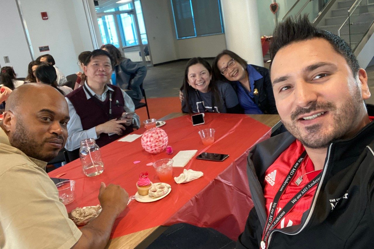 Five people around a table