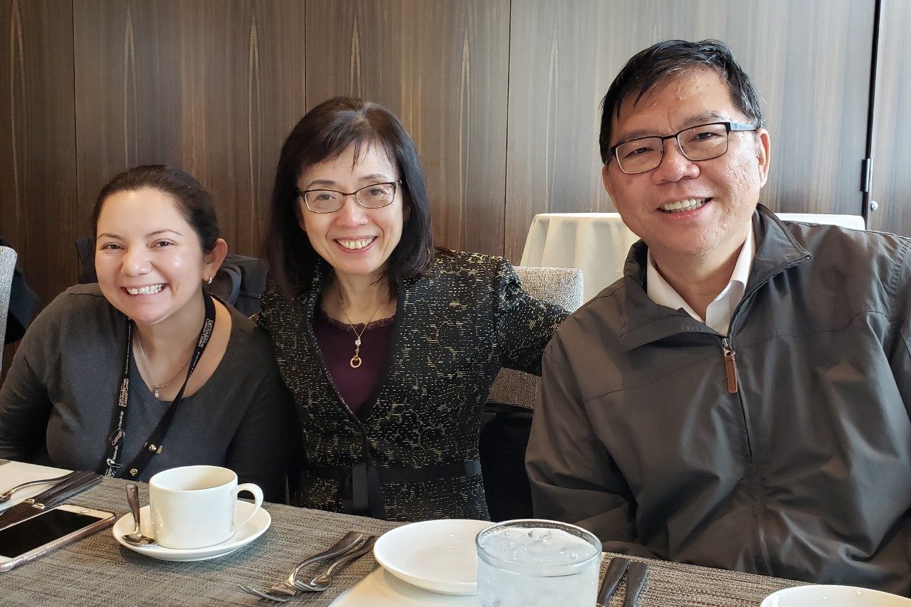 Three people at a table