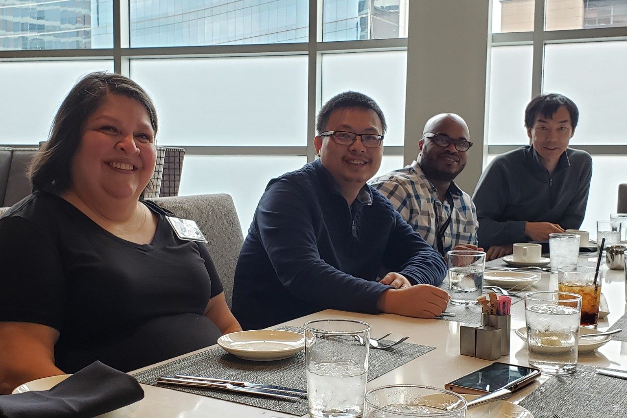 Four people at a table