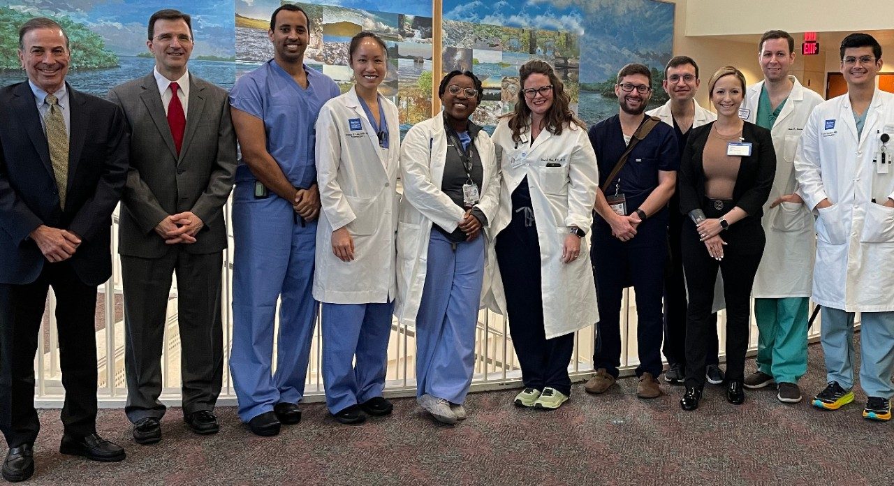 Neurosurgical trainees pose with guest speakers at the MD Anderson Skull Base Course