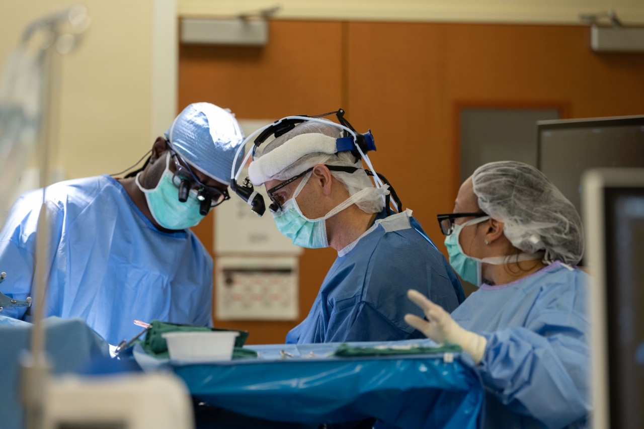 Dr. Lang performing neurosurgery